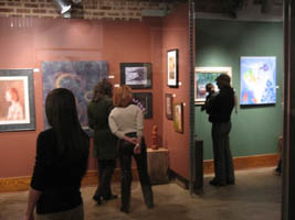 Reception attendees enjoy the art.