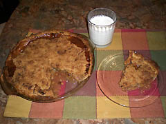 Slice of warm apple pie with glass of milk